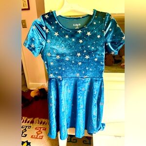 Super cute shimmery silver stars on a beautiful blue velvet skater dress. Comfy!